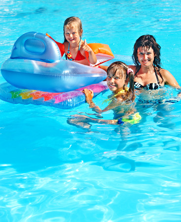 Family with children in swimming pool. Summer outdoor.の写真素材