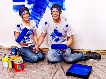 Happy family paint wall at home.の写真素材