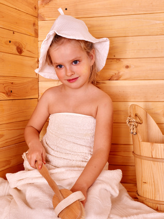 Happy with child relaxing at sauna.の写真素材