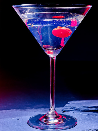 Transparent cherry cocktail on black background. Cocktail card 57.の写真素材