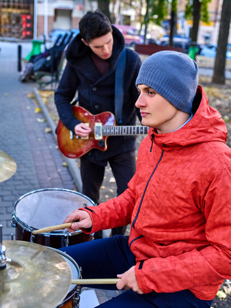 Music street men performers on autumn park outdoor.の写真素材