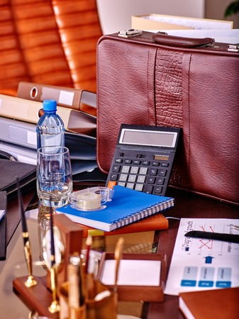 Business interior on table with bottle water and leather chair in office.の写真素材