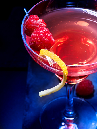 Top view of raspberries cocktail part on black background. Alcohol cocktail with berry.の写真素材