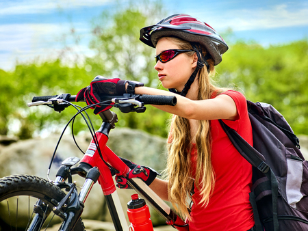 Woman on bicycle ride mountain.の写真素材