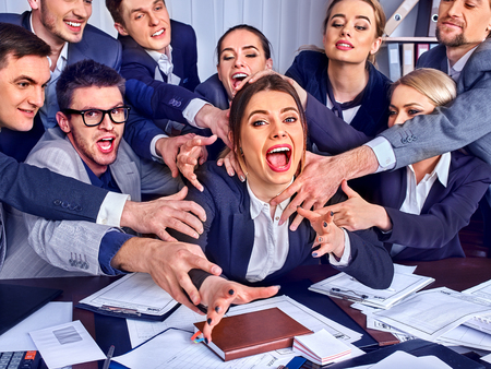 Mad business people office. Team people are unhappy with their leader. Mad crowd in stress throw up their chiefs papers. New employee is not well received in team.の写真素材