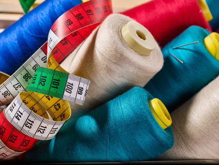 Coil viscose threads for overlock and measuring tape in sewing supplies sewing notions.の写真素材