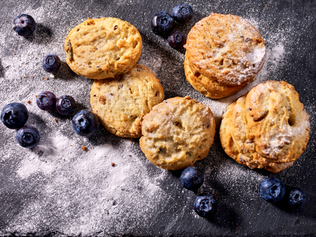 Serving food on slate onto wooden table. Oatmeal cookies biscuit with blueberry on picnic. Chocolate Xmas holiday chip cookies tied with string. Perfect product. Homemade, delicious recipes.の写真素材
