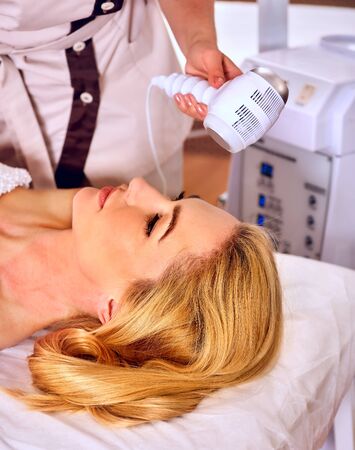 Radiofrequency treatment. Removes cellulite and body fat as well as minimizes sagging skin for woman in day beauty spa salon.の写真素材