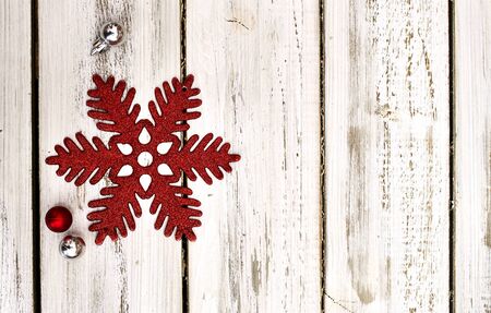 Christmas snowflake decoration and Xmas glitter ball white wooden boards. Horizontal long frame.の写真素材