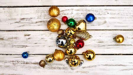 Christmas decorations design top view of Xmas balls ornaments on white wooden boards . Horizontal frame banner.の写真素材