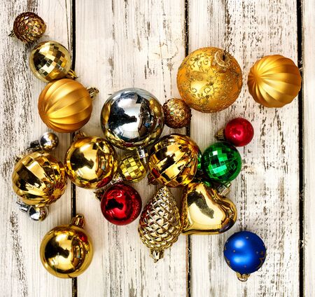 Christmas decorations design top view of Xmas balls ornaments on white wooden boards . Square frame .の写真素材