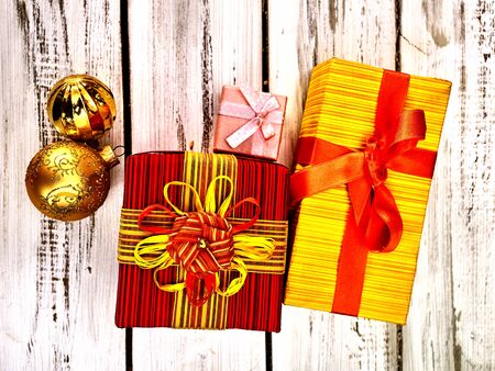 Christmas gift box , Xmas decorations and balls ornaments on white wooden table. Top view horizontal frame .の写真素材