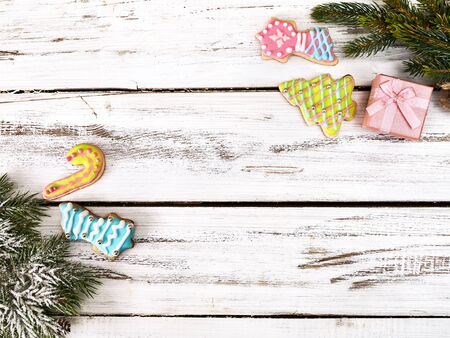 Christmas frame ball decorations and tinsel with copy space from white wooden boards.の写真素材