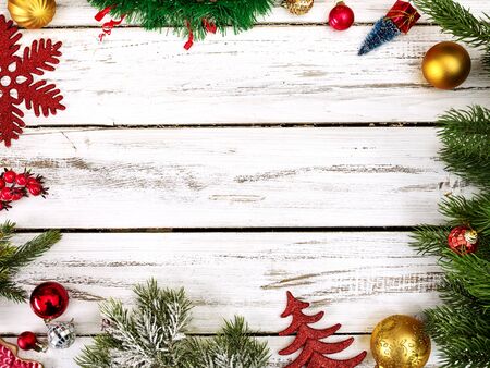 Christmas frame ball decorations and tinsel with copy space from white wooden boards.の写真素材