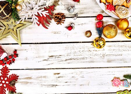 Christmas frame ball decorations and tinsel with copy space from white wooden boards.の写真素材