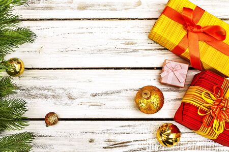 Christmas frame ball decorations and gift box with copy space from white wooden boards.の写真素材