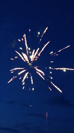 Fireworks in the night sky, New Year's Eve celebration.の写真素材