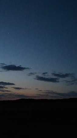 Night sky with moon and stars in the desert of Namibia.の写真素材
