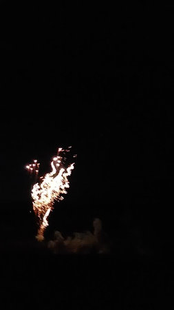 Fireworks in the night sky. The firework is in the dark.の写真素材