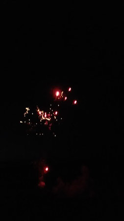 Fireworks in the night sky with red and yellow colors. Fireworks in the night sky.の写真素材