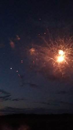 fireworks in the night sky with clouds, fireworks in the night skyの写真素材