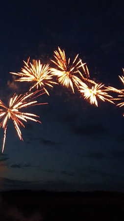 Colorful fireworks of various colors over night sky, New Year celebrationの写真素材