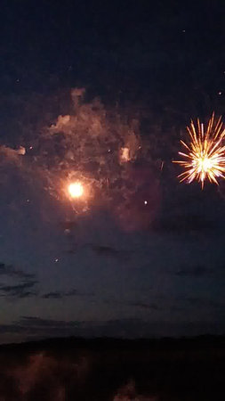 Fireworks on the night sky with clouds in the background. new yearの写真素材