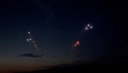 fireworks in the night sky with stars and comets in the skyの写真素材