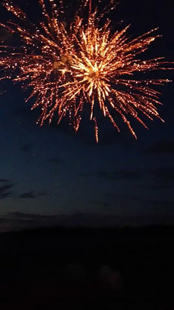 fireworks in the night sky on a background of the dark skyの写真素材