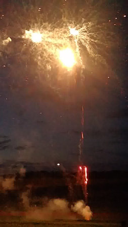 fireworks in the night sky with smoke and firework in the skyの写真素材