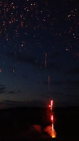 Fireworks in the night sky over the cityの写真素材