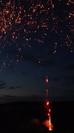 fireworks in the night sky with sparks from the firecrackersの写真素材