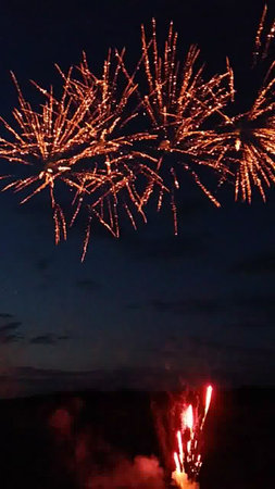 Colorful fireworks of various colors over the night sky with dazzling displayの写真素材