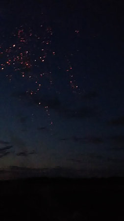 fireworks in the night sky with a lot of smoke and starsの写真素材