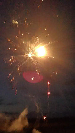 fireworks in the night sky, with a lot of sparks.の写真素材