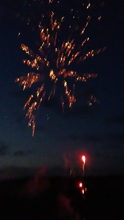 fireworks in the night sky on the beach of the Baltic Seaの写真素材