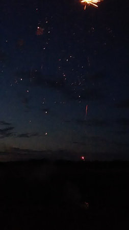 Fireworks in the night sky. Night sky with stars and smoke.の写真素材