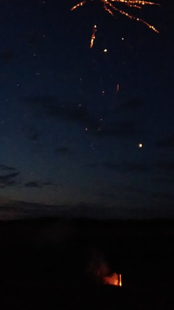 Fireworks in the night sky over the village of Masai Mara, Kenyaの写真素材