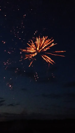 Colorful fireworks of various colors over dark sky at night for celebrationの写真素材