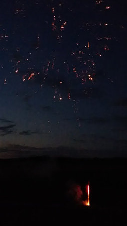 Fireworks in the night sky with a lot of smoke and fireの写真素材
