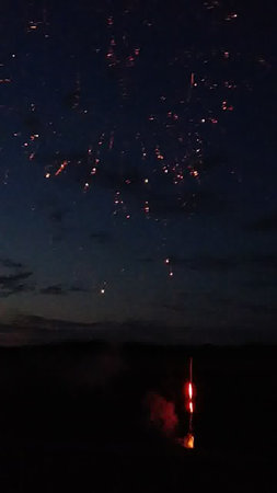 fireworks in the night sky with a lot of smoke and fireの写真素材