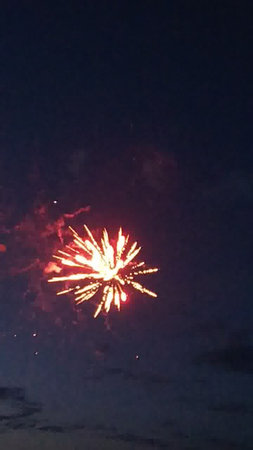 Fireworks in the night sky. Celebration of New Year and Christmasの写真素材