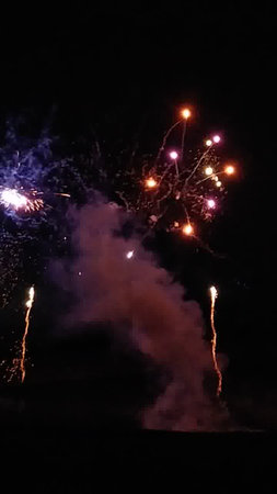 Colorful fireworks in the night sky. New Year and Christmas celebrationの写真素材