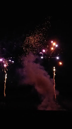 fireworks in the night sky, celebration of New Year and Christmasの写真素材