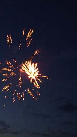 Fireworks in the night sky, celebrating the New Year and Christmasの写真素材