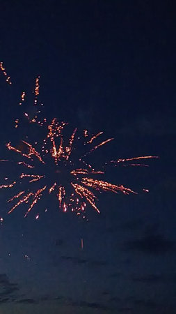 Fireworks in the night sky, New Year's Eve celebration.の写真素材