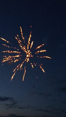 Fireworks in the night sky, celebrating the New Year and Christmasの写真素材