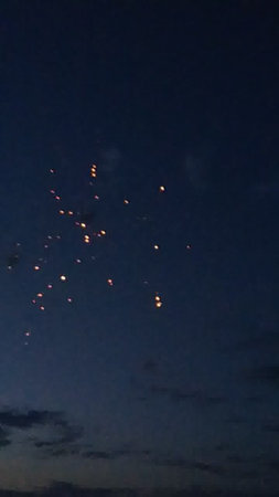 fireworks in the night sky with a lot of light and smokeの写真素材
