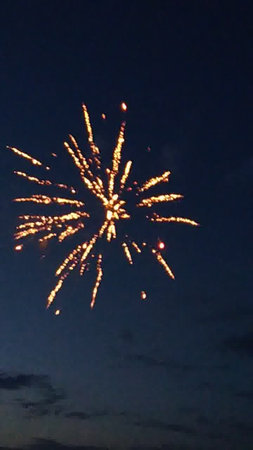Fireworks in the night sky, celebrating the New Year and Christmasの写真素材