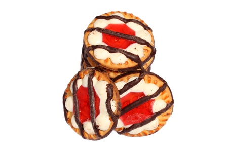 Sweet and crunchy biscuits cookies with jelly and striped chocolate on top isolated on whiteの写真素材
